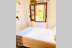 Un pat sau paturi într-o cameră la Villa Leon Menorca, tu casa menorquina!