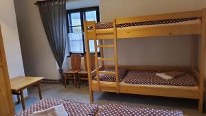 Ein Bett oder Betten in einem Zimmer der Unterkunft Baurů Dvůr