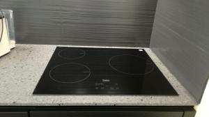 a black stove top oven in a kitchen at E Cabanacce in Aléria