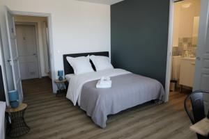 Ένα ή περισσότερα κρεβάτια σε δωμάτιο στο Le Pont de Livinhac