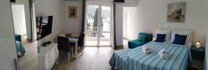 a bedroom with a bed with two cats laying on it at Meridiens in Dubrovnik