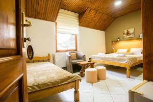 Katil atau katil-katil dalam bilik di Guest House Vila Alexandar