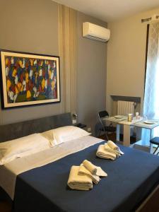 Łóżko lub łóżka w pokoju w obiekcie B&B SALento Garden