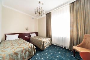 Łóżko lub łóżka w pokoju w obiekcie Parisel Palace Centrum Konferencyjno-Wypoczynkowe Klimki pod Łukowem