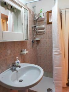 a bathroom with a sink and a shower at La Dependance b&b in Campobasso