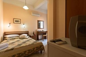 Postel nebo postele na pokoji v ubytování Mirabello Hotel