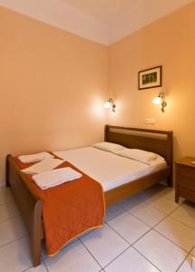 Postel nebo postele na pokoji v ubytování Mirabello Hotel