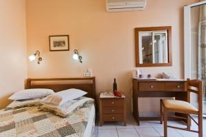 Postel nebo postele na pokoji v ubytování Mirabello Hotel