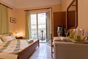 Postel nebo postele na pokoji v ubytování Mirabello Hotel