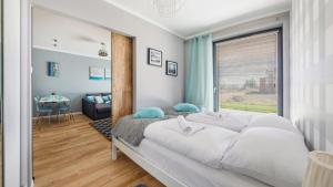 Posteľ alebo postele v izbe v ubytovaní Apartament Kołobrzeg Resort
