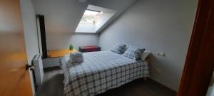 En eller flere senge i et værelse på Duplex en Casas da Bríxida - Cangas do Morrazo