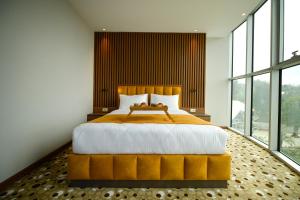 Ένα ή περισσότερα κρεβάτια σε δωμάτιο στο Calligraphy Hotel and Cottages