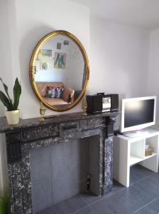 Een TV en/of entertainmentcenter bij Land Scape guesthouse
