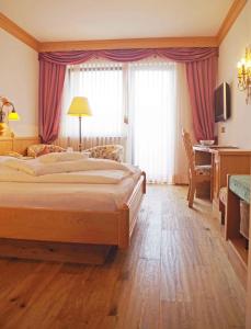 Postel nebo postele na pokoji v ubytování Hotel Bergland