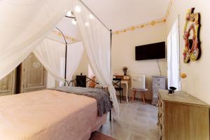 A bed or beds in a room at Come Nelle Favole the Classic B&B