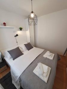 Postel nebo postele na pokoji v ubytování Apartmani Callista