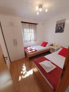 Postel nebo postele na pokoji v ubytování Apartmani Callista