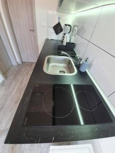 Kuchyň nebo kuchyňský kout v ubytování Apartmani Callista