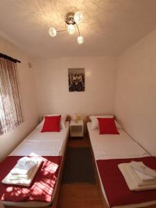 Postel nebo postele na pokoji v ubytování Apartmani Callista