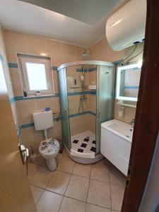 Kúpeľňa v ubytovaní Apartmani Callista