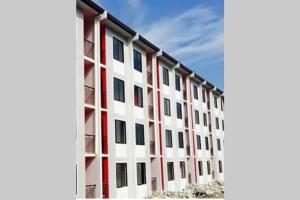 a large white building with red and white at AFFORDABLE BUDGET FRIENDLY STUDIO UNIT in Cebu City