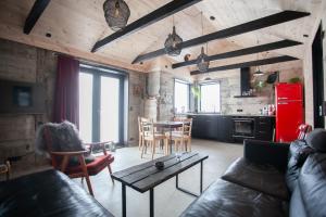 a living room with a couch and a table at Luxury Cottage in Tórshavn in Tórshavn