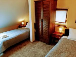 Łóżko lub łóżka w pokoju w obiekcie Drzewna Apartamenty - Kupiecka 5