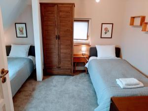 Łóżko lub łóżka w pokoju w obiekcie Drzewna Apartamenty - Kupiecka 5