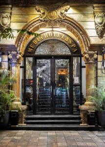 an entrance to a hotel with an ornate door at Hanoi Media Hotel & Spa in Hanoi