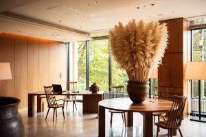 
a living room filled with furniture and a table at Hyatt Regency Hakone Resort and Spa in Hakone
