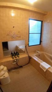 A bed or beds in a room at FUTO HOUSE -Ippon no Enpitsu-