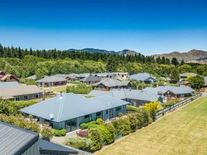 an aerial view of a residential neighborhood with houses at 5 Hepburn Lane in Hanmer Springs