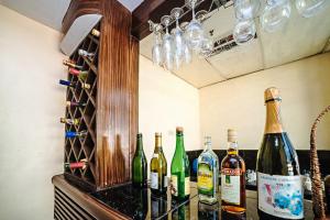 a bunch of bottles of wine on a counter at RedDoorz near Ormoc Port Terminal in Ormoc