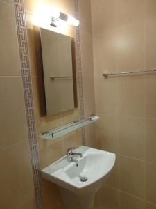 a bathroom with a sink and a mirror at Boruna Guest House in Sozopol +78 photos