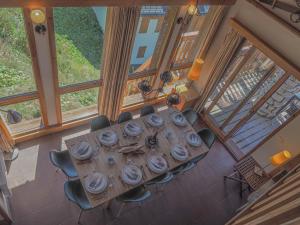 an overhead view of a table in a room with windows at La Couronne in Peisey-Nancroix