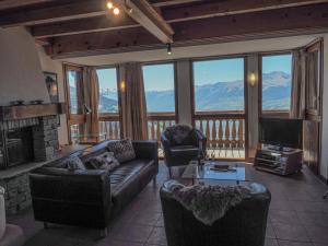 a living room with a view of a mountain at La Couronne in Peisey-Nancroix