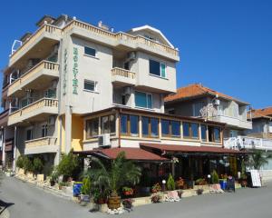 a large building with a store in front of it at Boruna Guest House in Sozopol