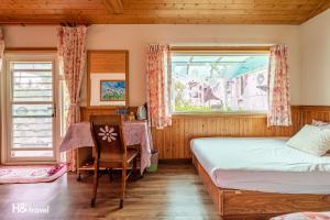Postel nebo postele na pokoji v ubytování Shan Tyi Homestay