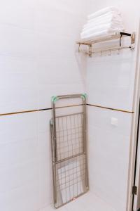 a white refrigerator in a kitchen with a towel rack at Hotel Nika in Essentuki