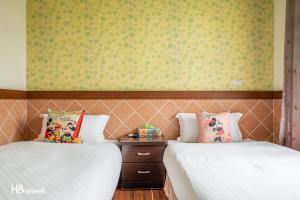 Postel nebo postele na pokoji v ubytování Shan Tyi Homestay