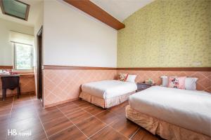 Postel nebo postele na pokoji v ubytování Shan Tyi Homestay