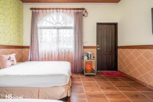 Postel nebo postele na pokoji v ubytování Shan Tyi Homestay