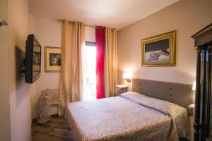Postel nebo postele na pokoji v ubytování B&B Luxury