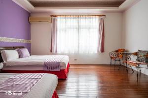 Postel nebo postele na pokoji v ubytování Shan Tyi Homestay