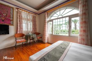 Postel nebo postele na pokoji v ubytování Shan Tyi Homestay