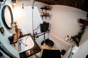 a small bathroom with a sink and a toilet at The Cosy Spot - Straja in Straja +10 photos
