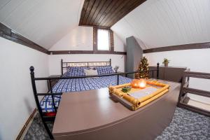 a bedroom with a bed with a christmas tree on it at The Cosy Spot - Straja in Straja