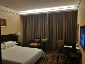TV a/nebo společenská místnost v ubytování Hua Shi Hotel