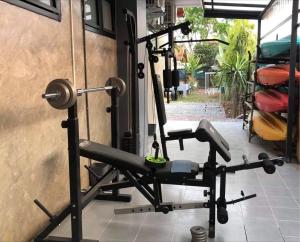 a room with a gym with a treadmill at Saythong boutique hotel in Chiang Khan