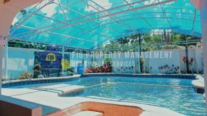 a large swimming pool in a building with a blue ceiling at Casita de Ruby Resort in Laguna in Bay
